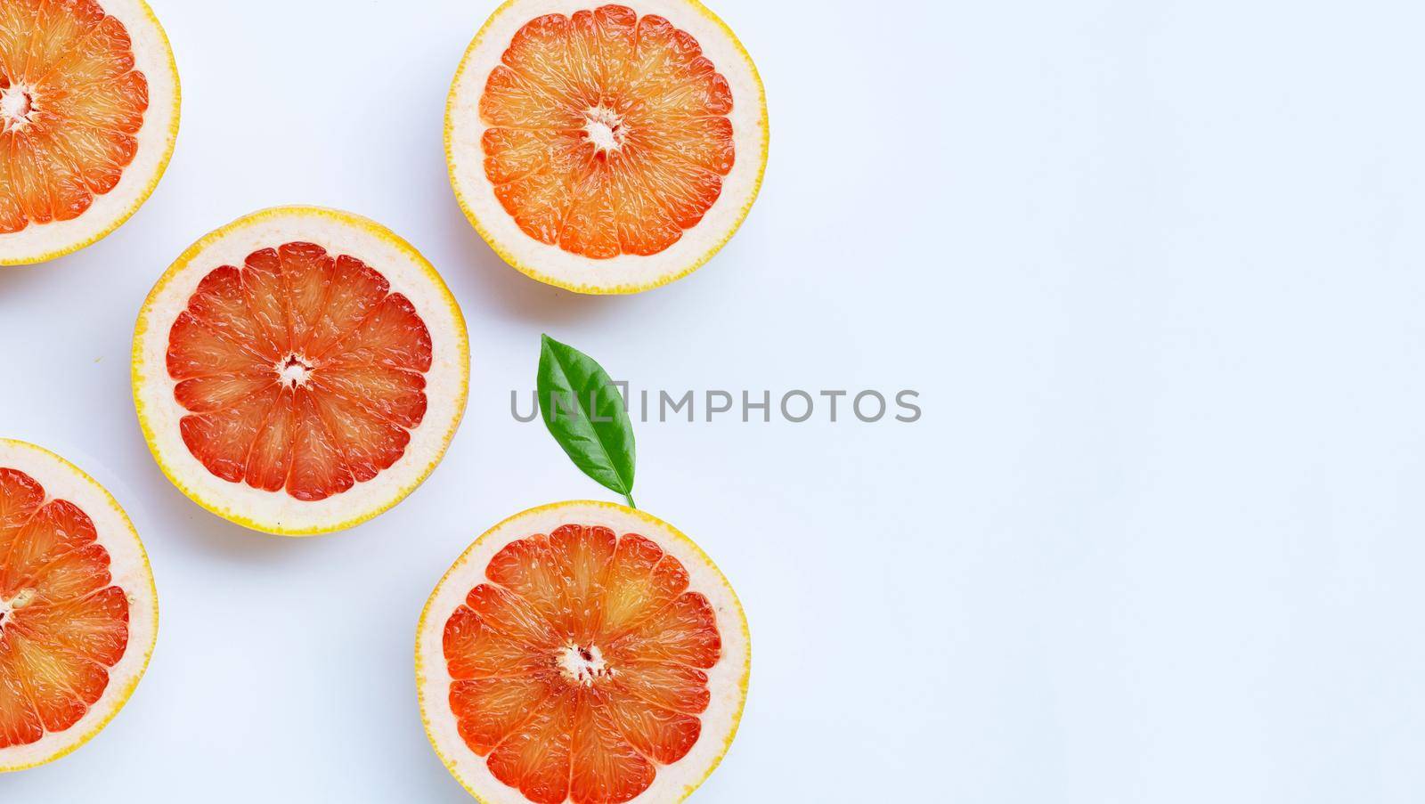 High vitamin C. Juicy grapefruit on white background.