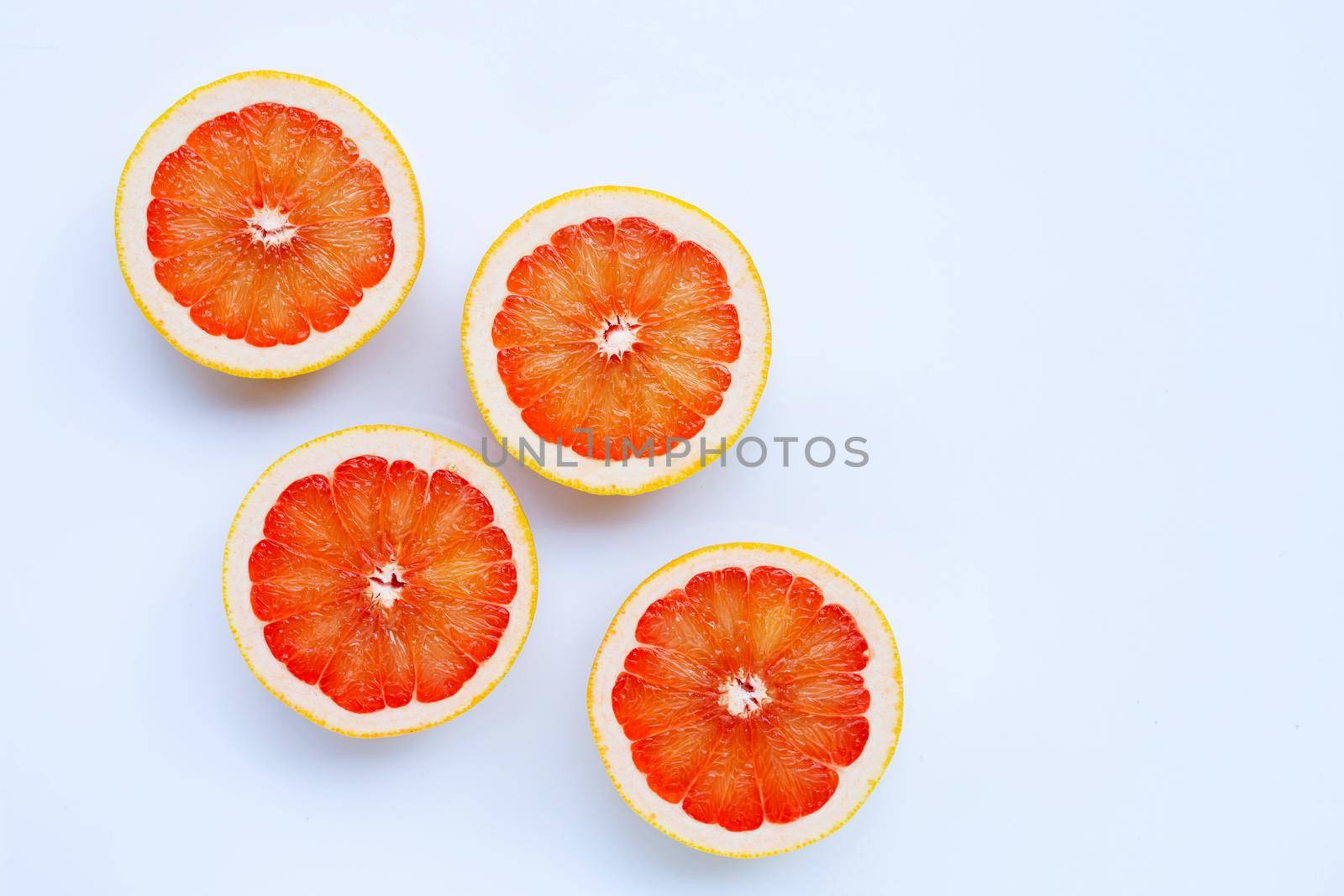 High vitamin C. Juicy grapefruit on white background.