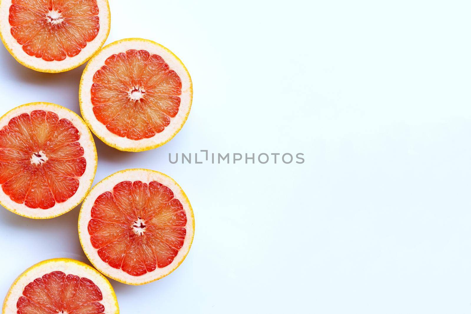 High vitamin C. Juicy grapefruit on white background.