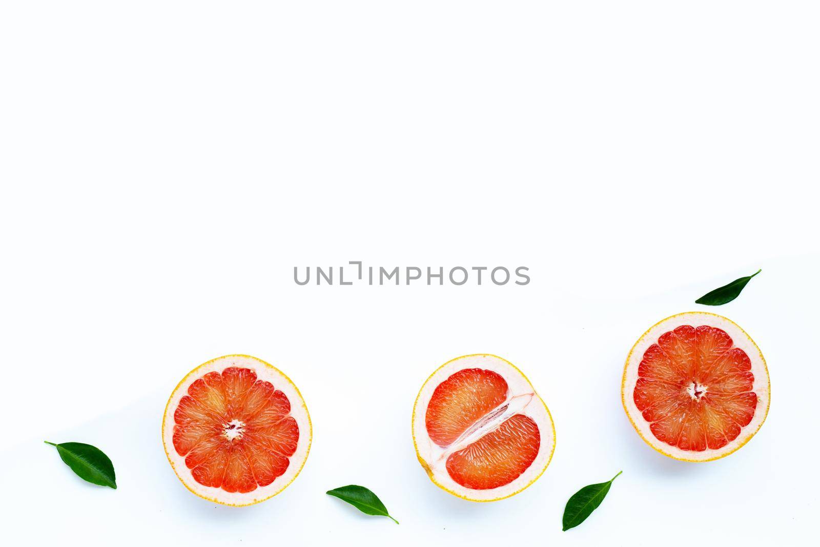 High vitamin C. Juicy grapefruit on white background.