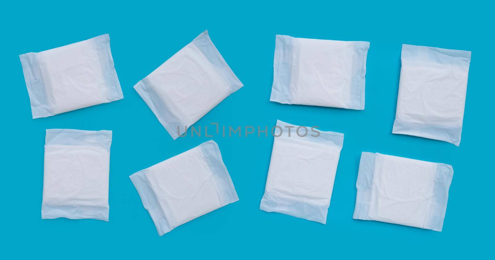 White sanitary pads on blue background. by Bowonpat