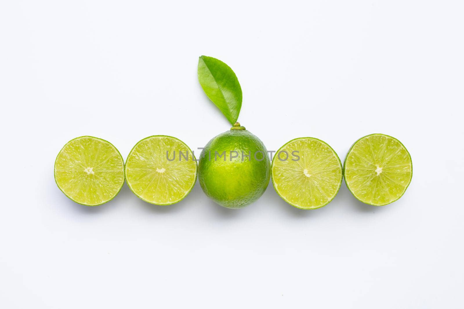 Limes with leaves isolated on white background.