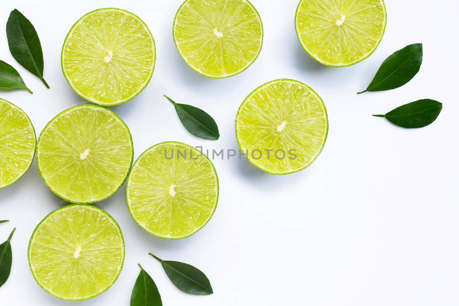 Limes with leaves isolated on white background.