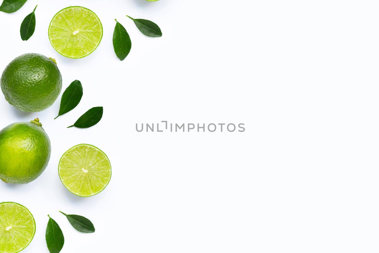 Limes with leaves isolated on white background.