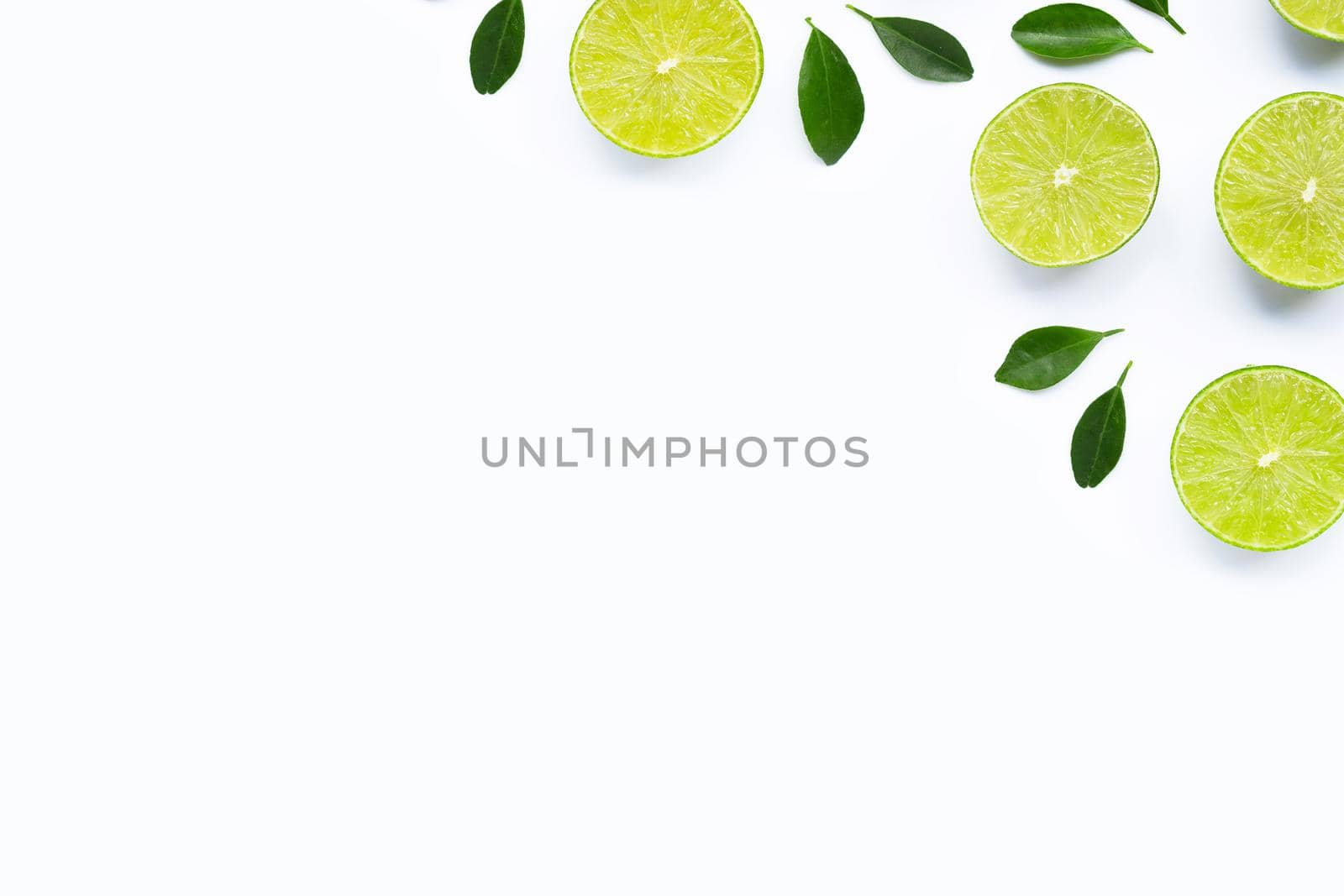 Limes with leaves isolated on white background.