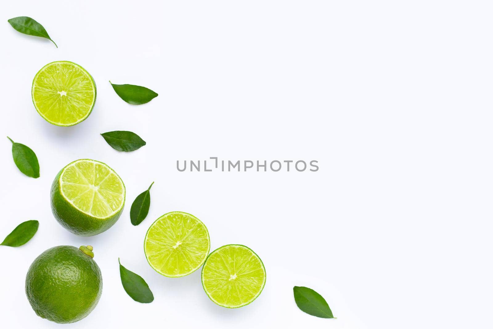 Limes with leaves isolated on white background.