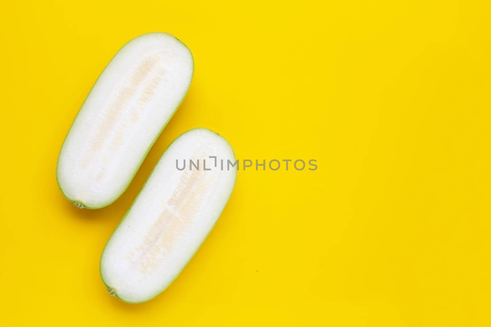 Winter melon on yellow background.