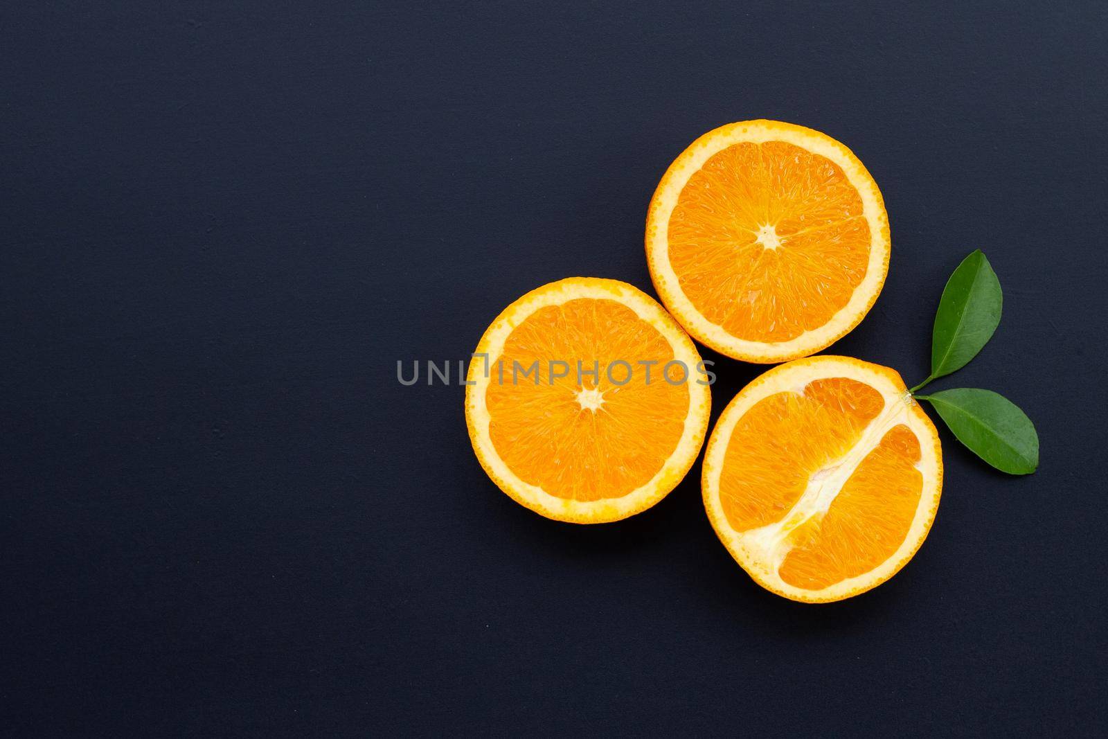 High vitamin C, Juicy and sweet. Fresh orange fruit on dark background.