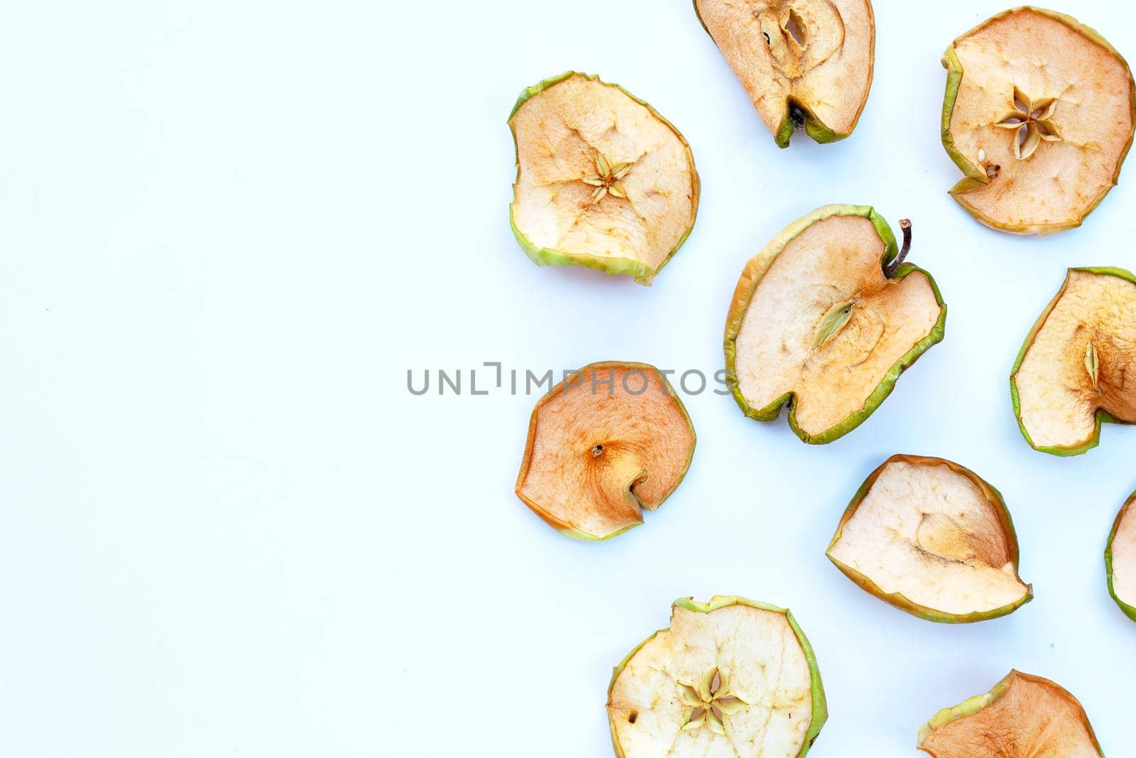 Dried apple slices on white background