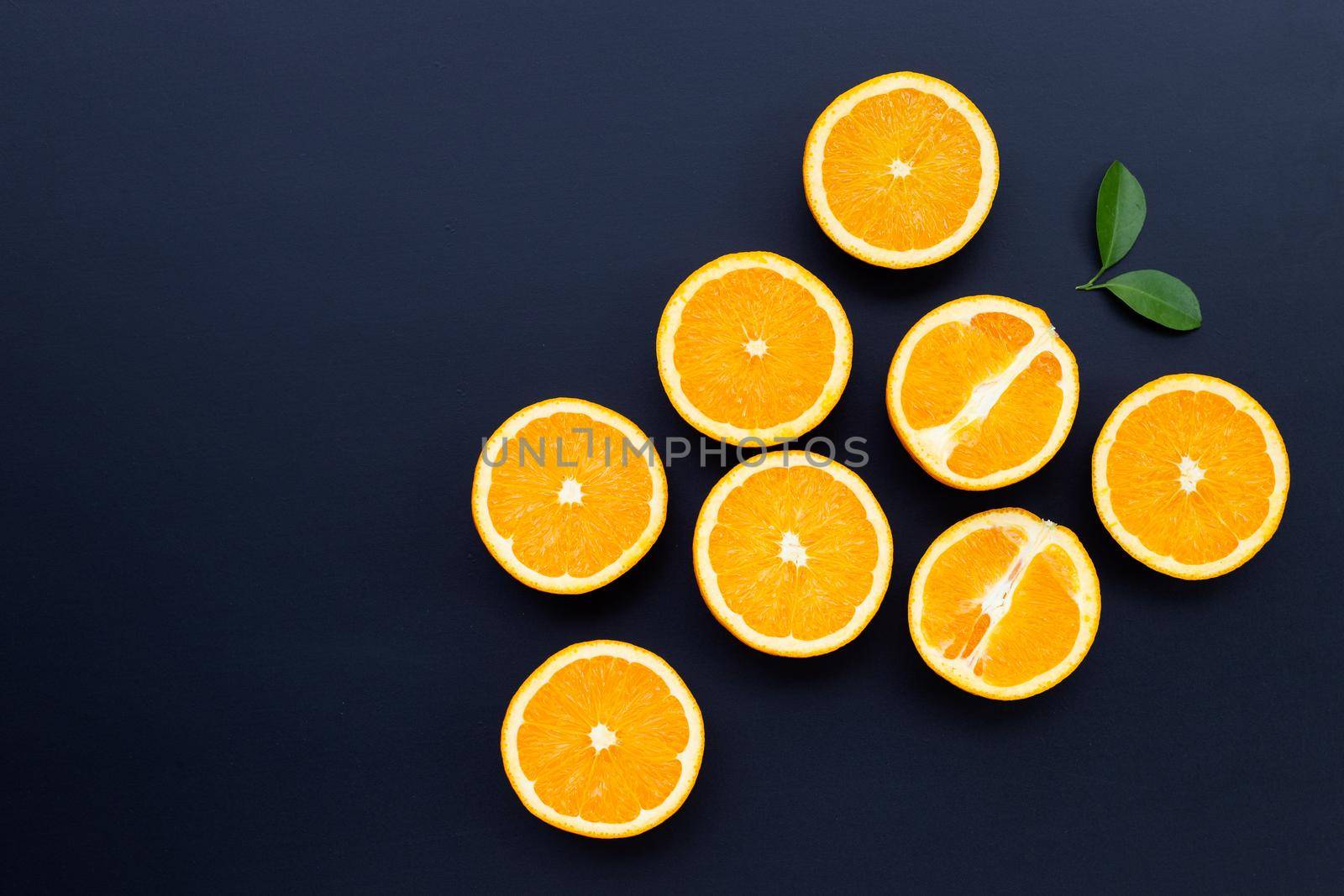 High vitamin C, Juicy and sweet. Fresh orange fruit on dark background.