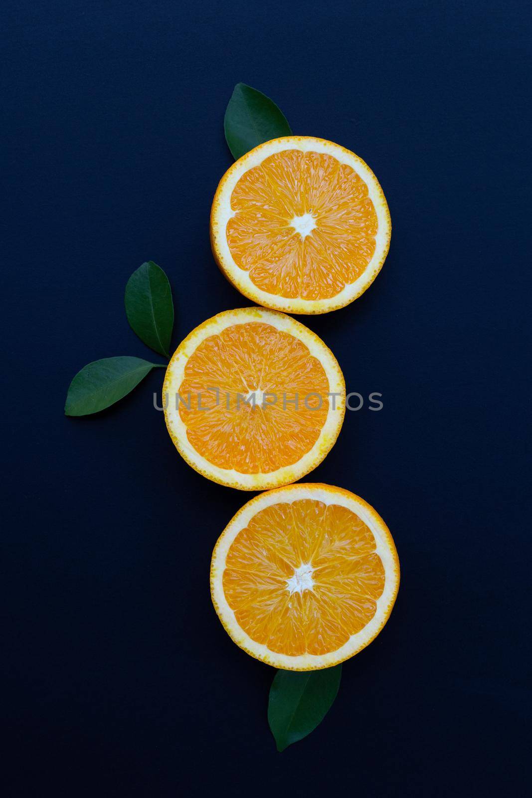 High vitamin C, Juicy and sweet. Fresh orange fruit on dark background. by Bowonpat