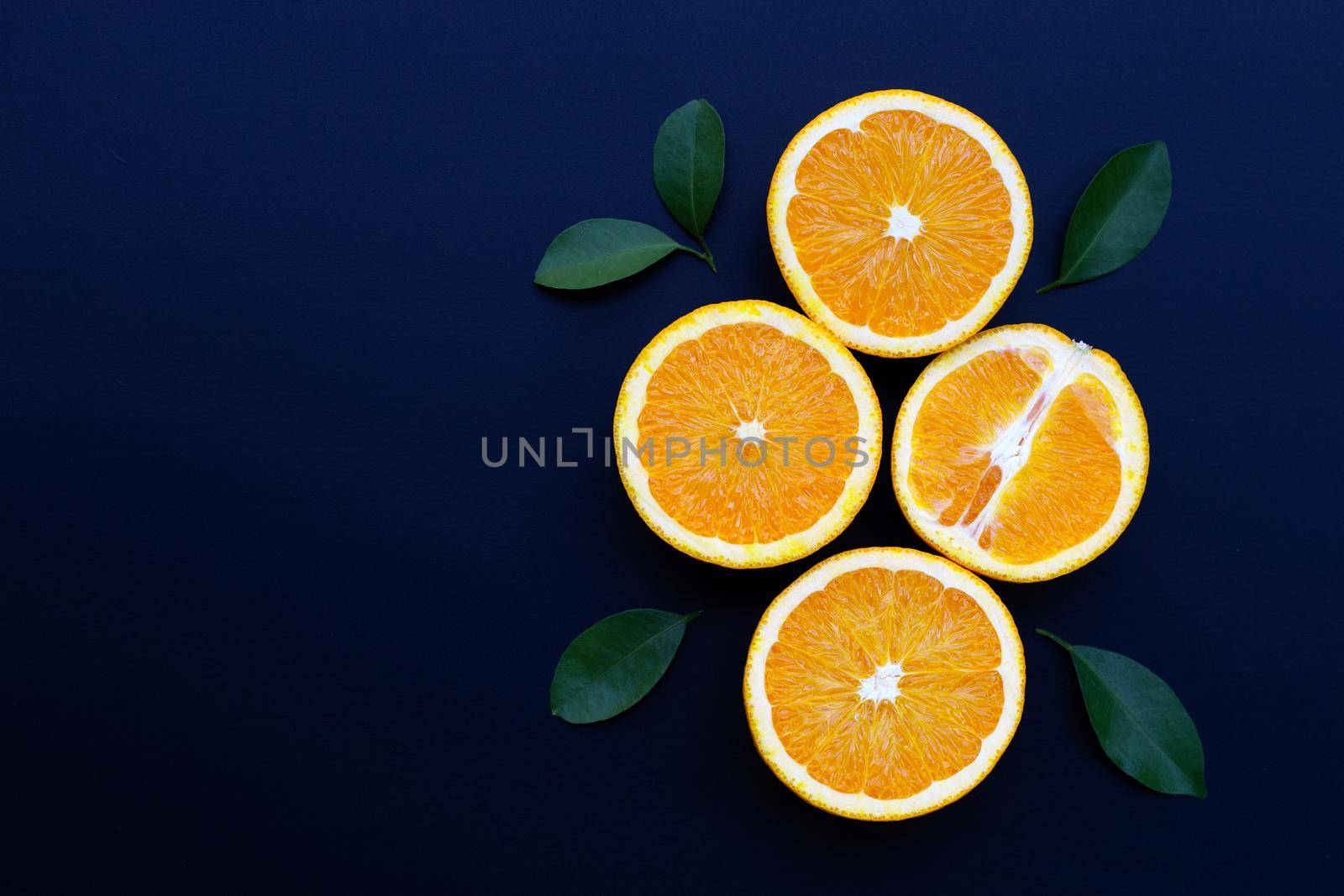 High vitamin C, Juicy and sweet. Fresh orange fruit on dark background.