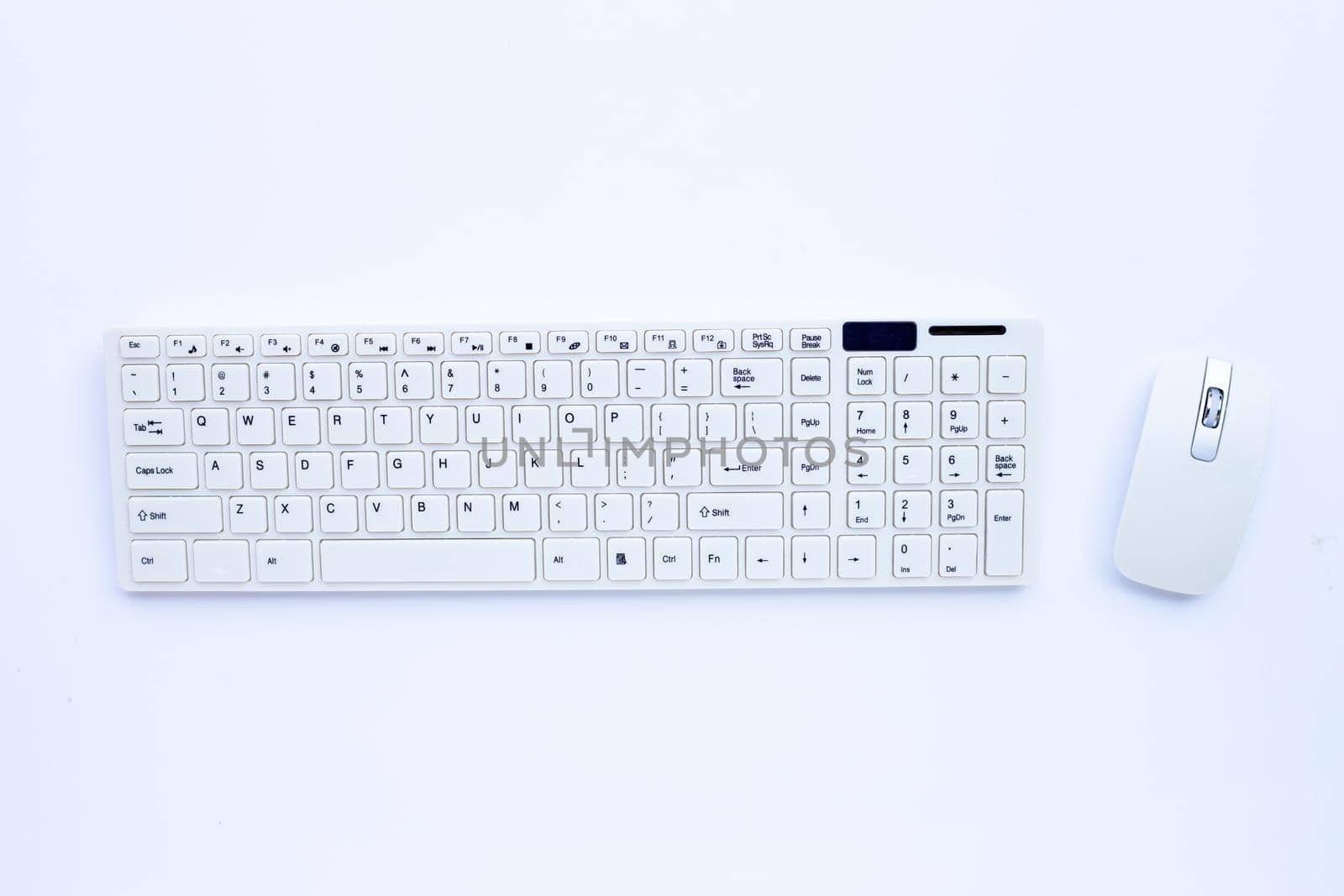 White computer keyboard and mouse on white background. Copy space