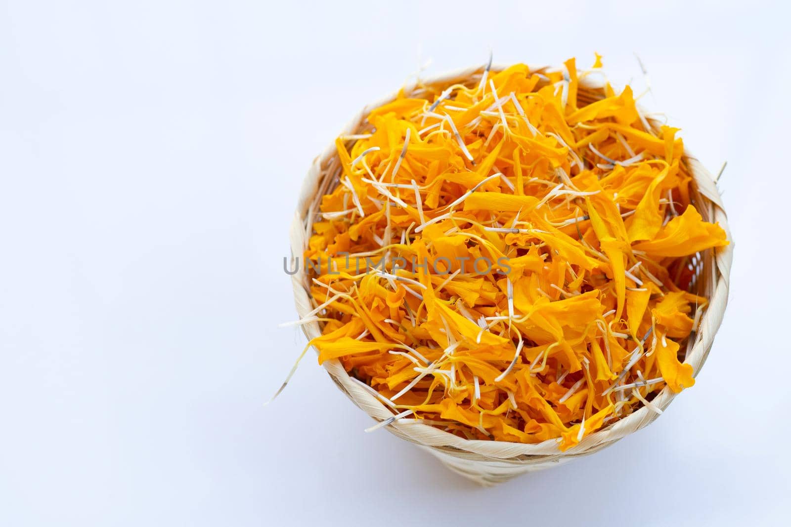 Petals of marigold flower on white background.