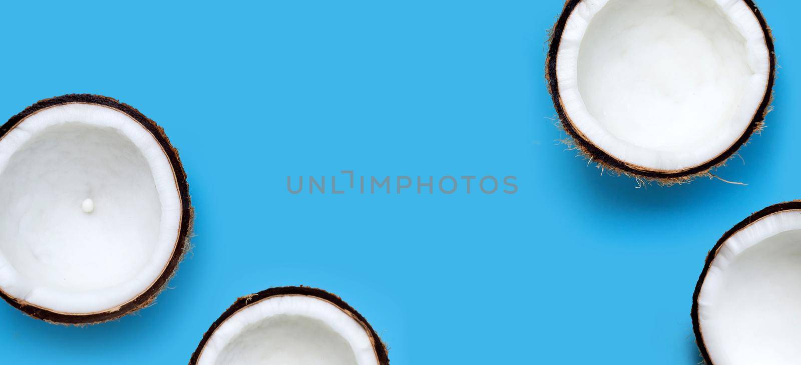 Coconuts on blue background. Top View