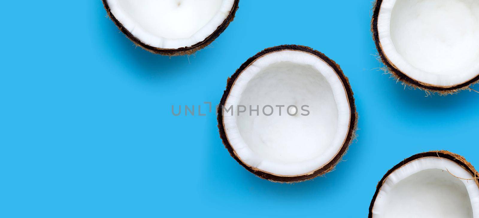 Coconuts on blue background. Top View by Bowonpat
