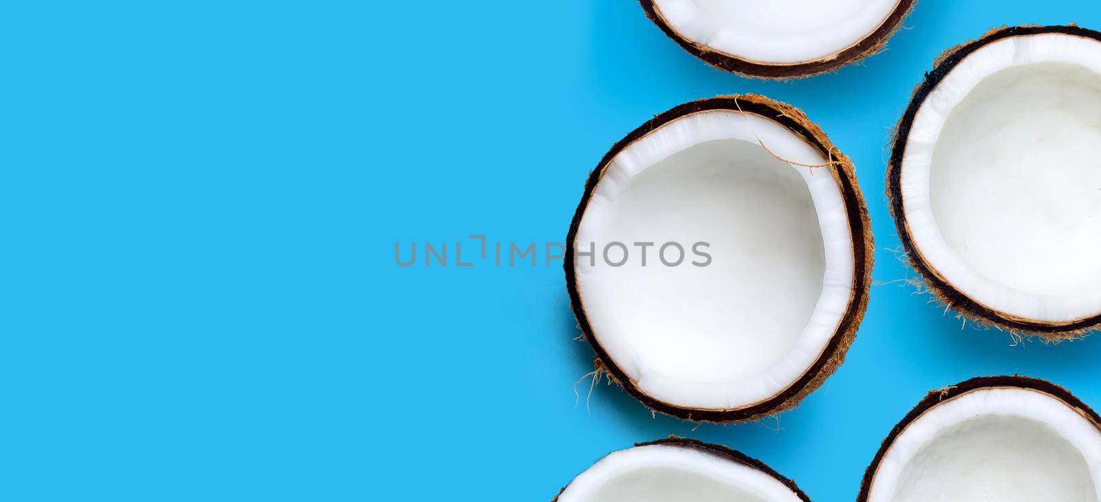 Coconuts on blue background. Top View