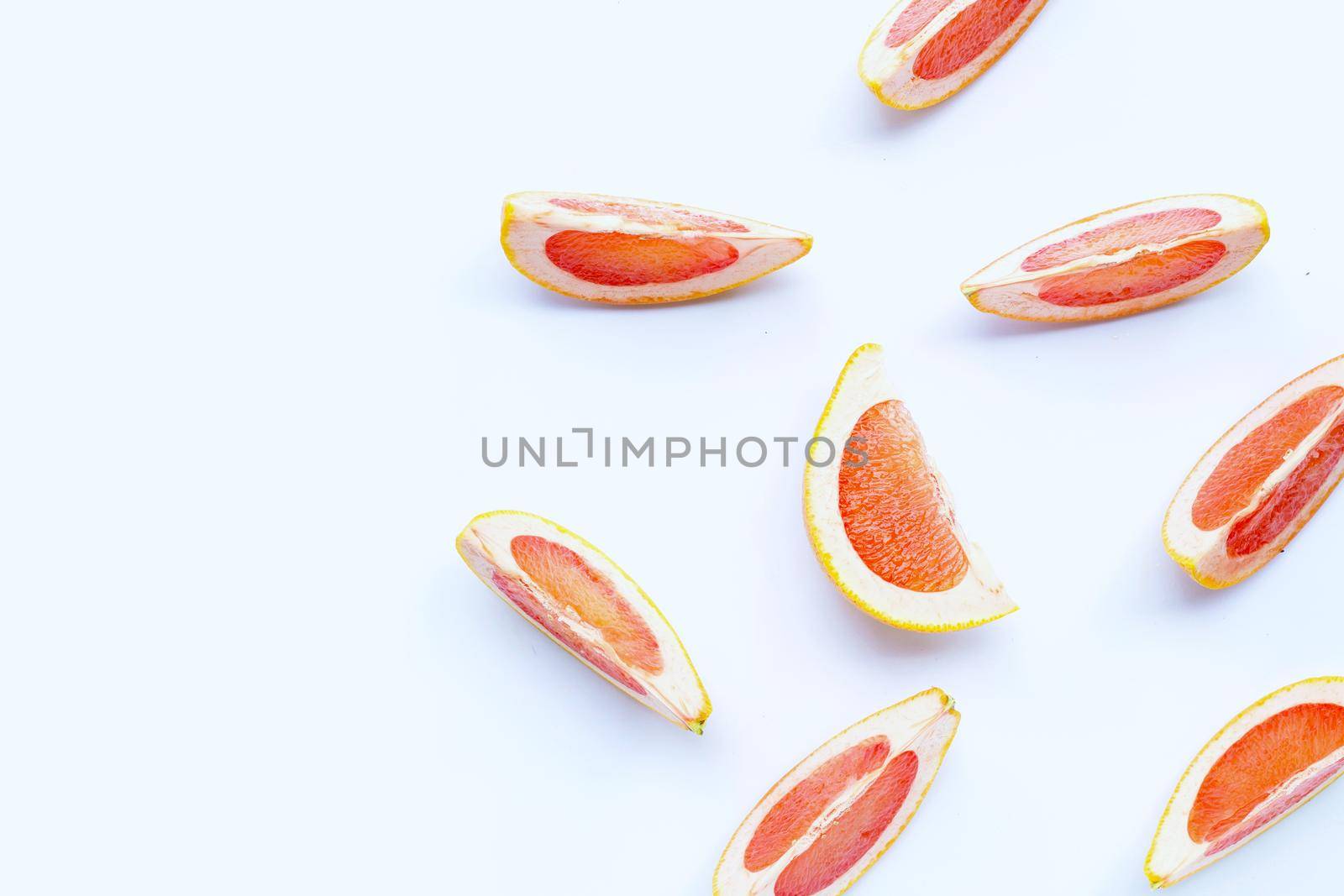 High vitamin C. Juicy grapefruit slices on white background.