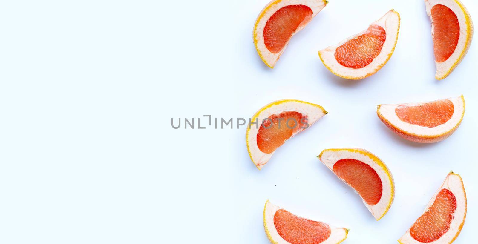 High vitamin C. Juicy grapefruit slices on white background.