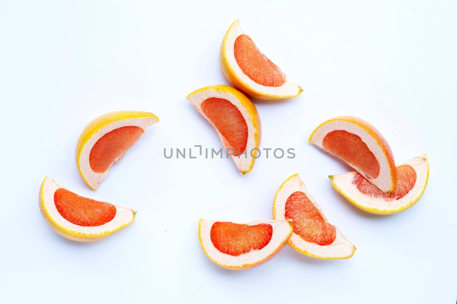 High vitamin C. Juicy grapefruit slices on white background.