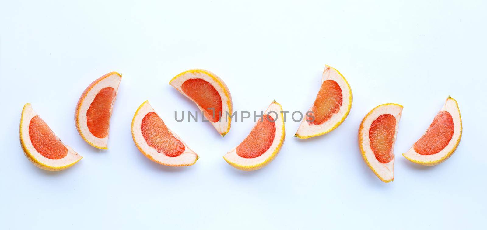 High vitamin C. Juicy grapefruit slices on white.  by Bowonpat