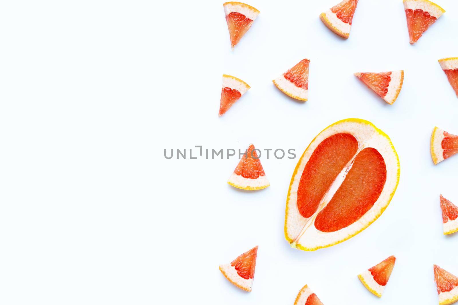 High vitamin C. Juicy grapefruit slices on white background.