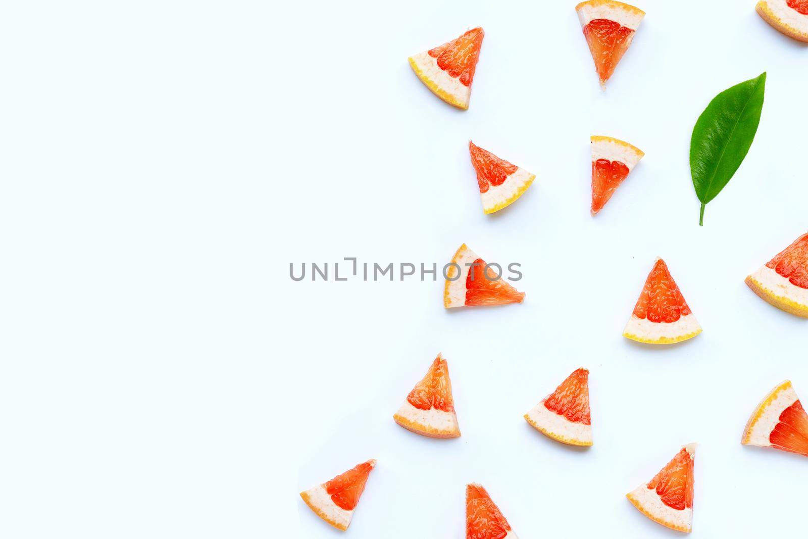 High vitamin C. Juicy grapefruit slices on white background.