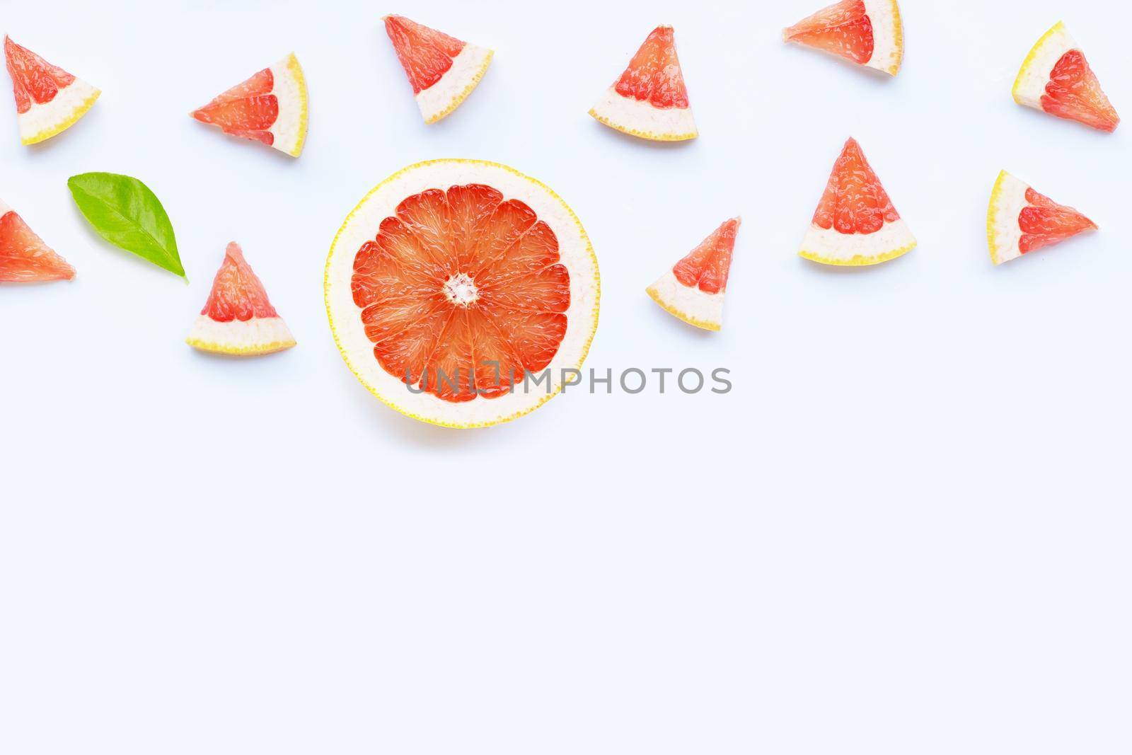 High vitamin C. Juicy grapefruit slices on white background.