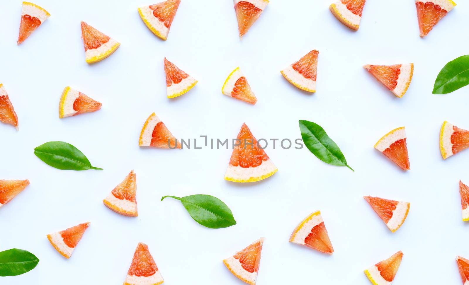 High vitamin C. Juicy grapefruit slices on white background.