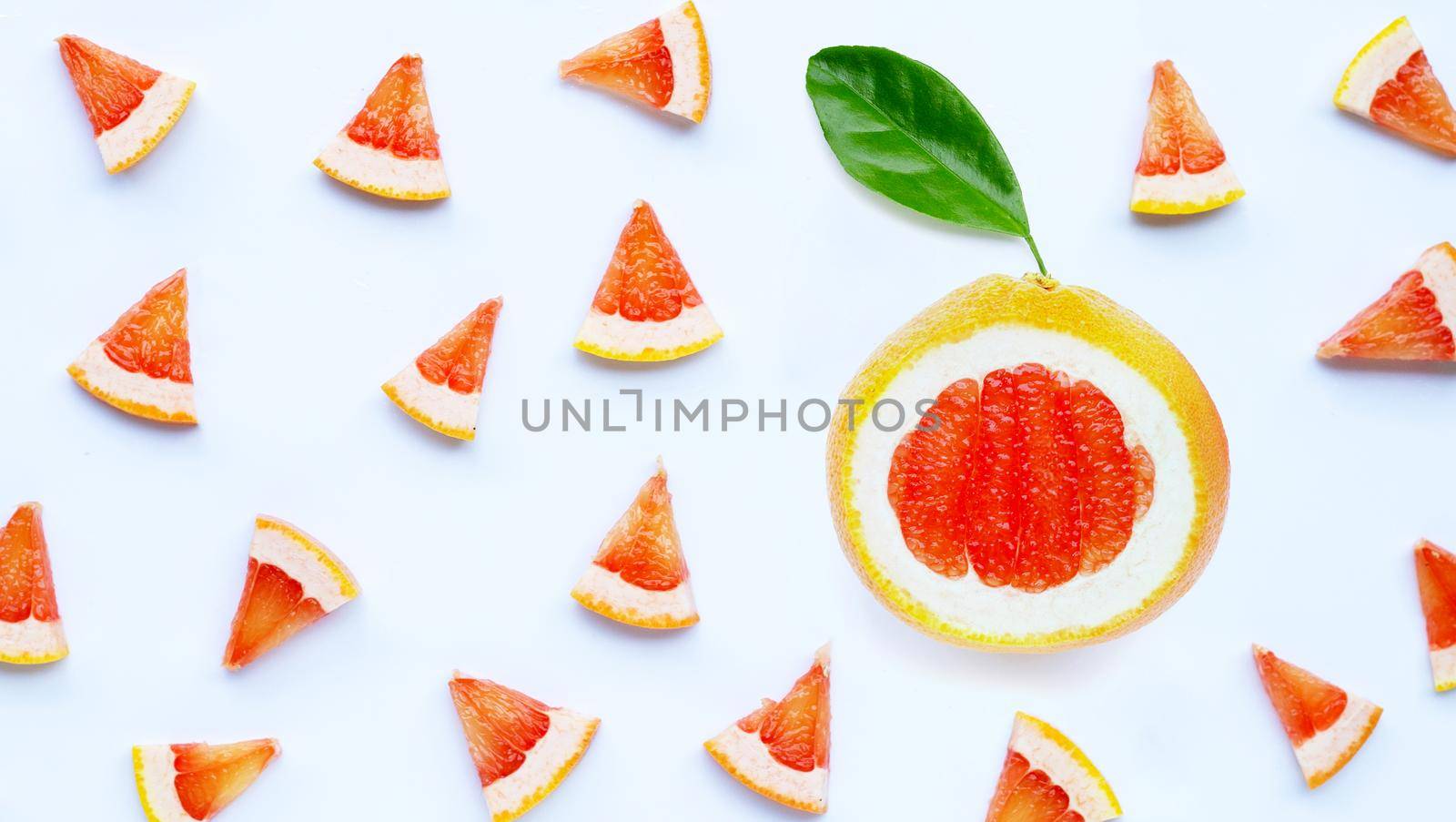 High vitamin C. Juicy grapefruit slices on white background.