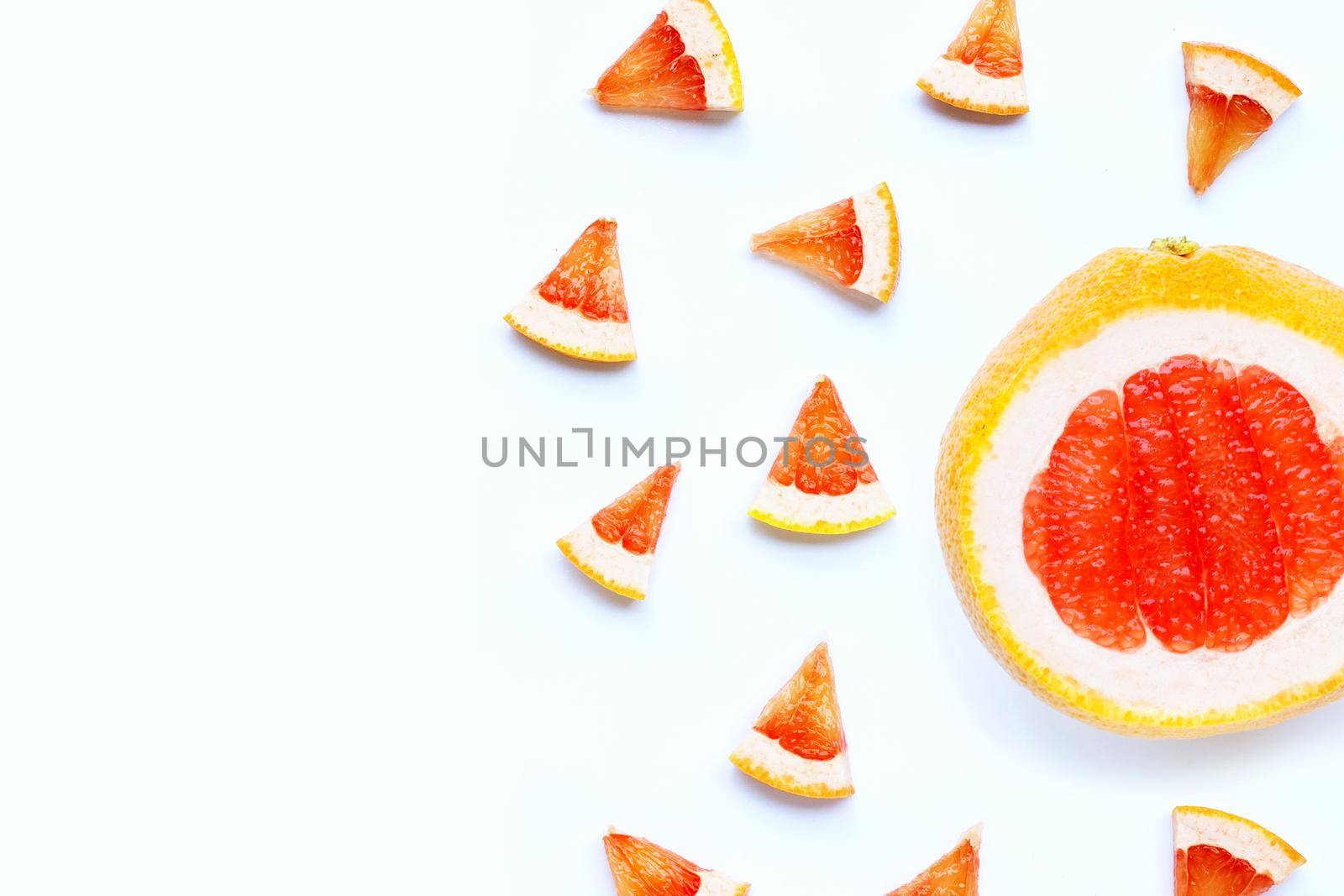 High vitamin C. Juicy grapefruit slices on white background.