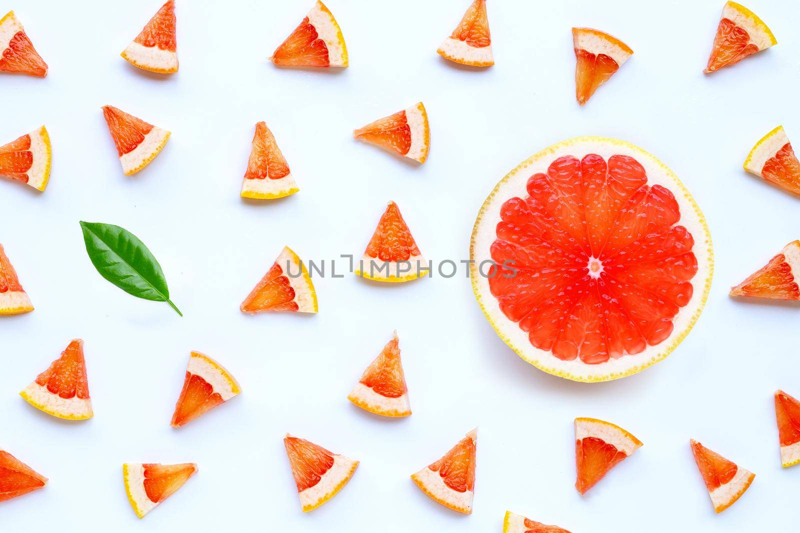High vitamin C. Juicy grapefruit slices on white background.