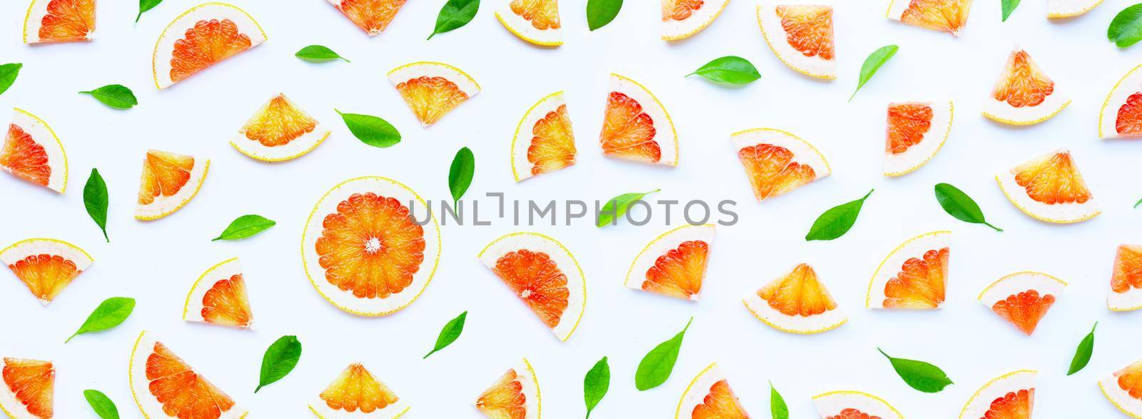 High vitamin C. Juicy grapefruit slices on white background.