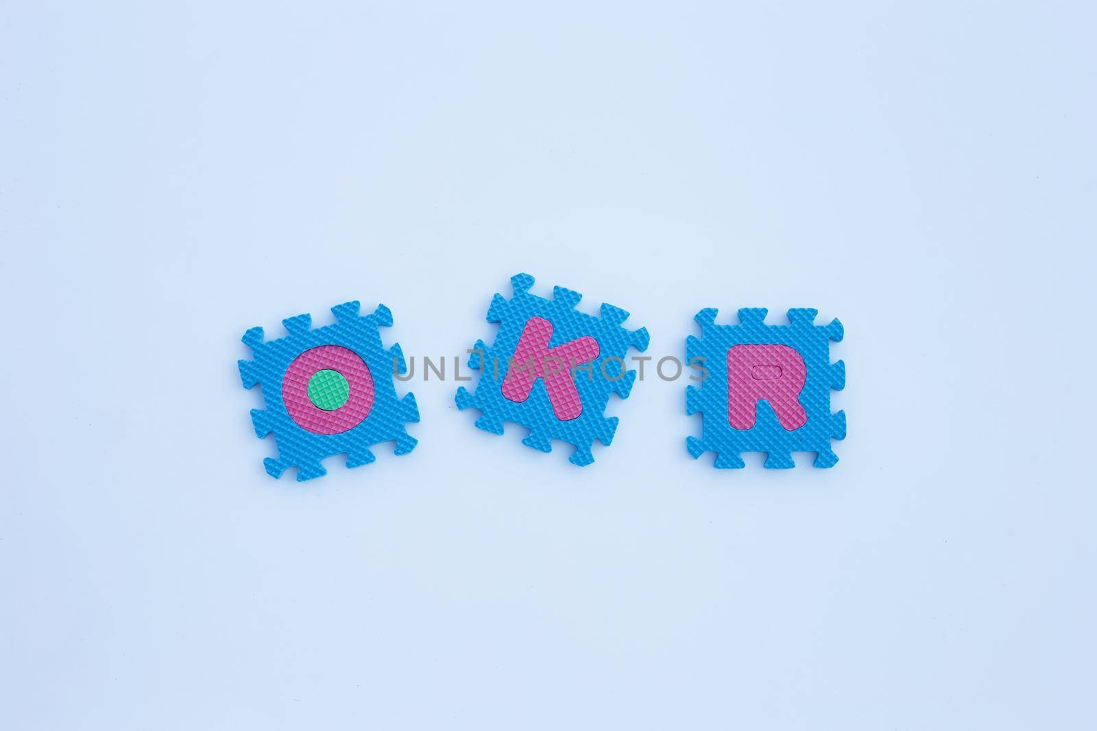 OKR alphabet puzzles on white background.