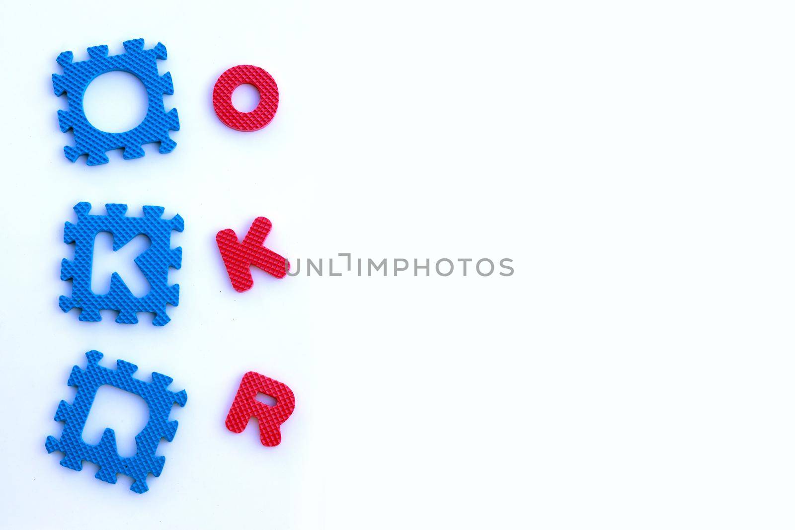 OKR puzzle alphabets on white background.