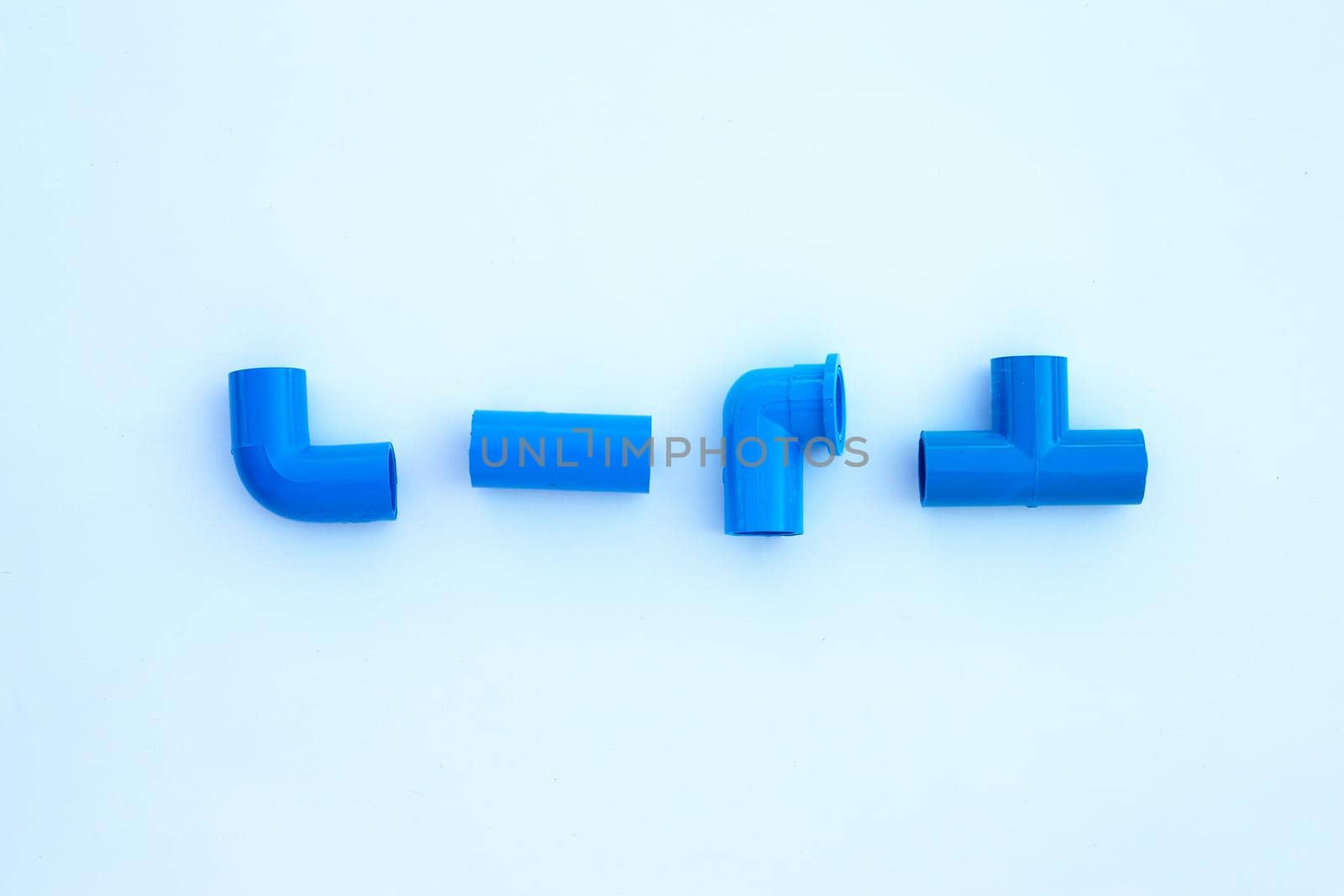 Blue pvc pipe connection isolated on white background.