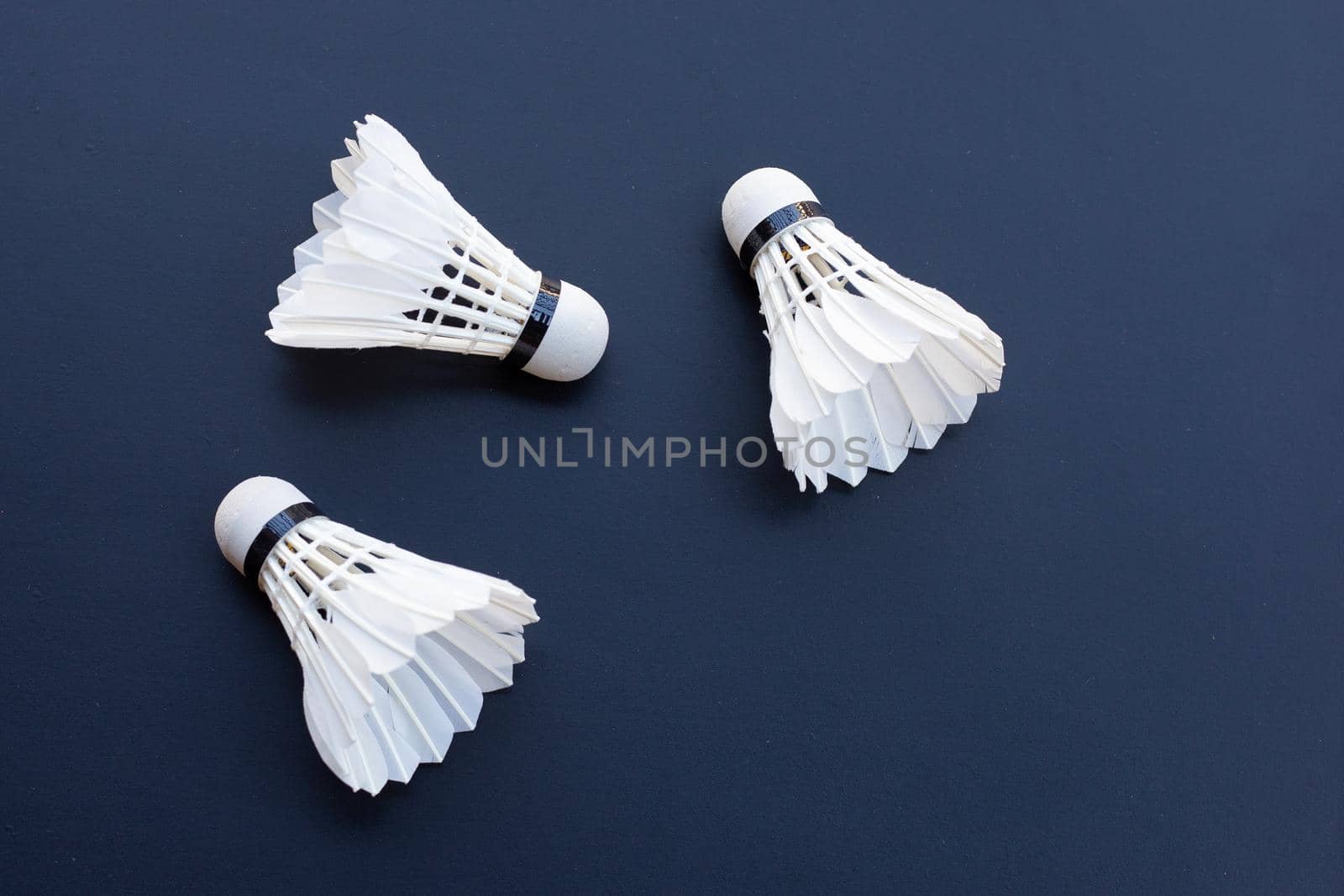 Shuttlecock or badminton balls on dark background.