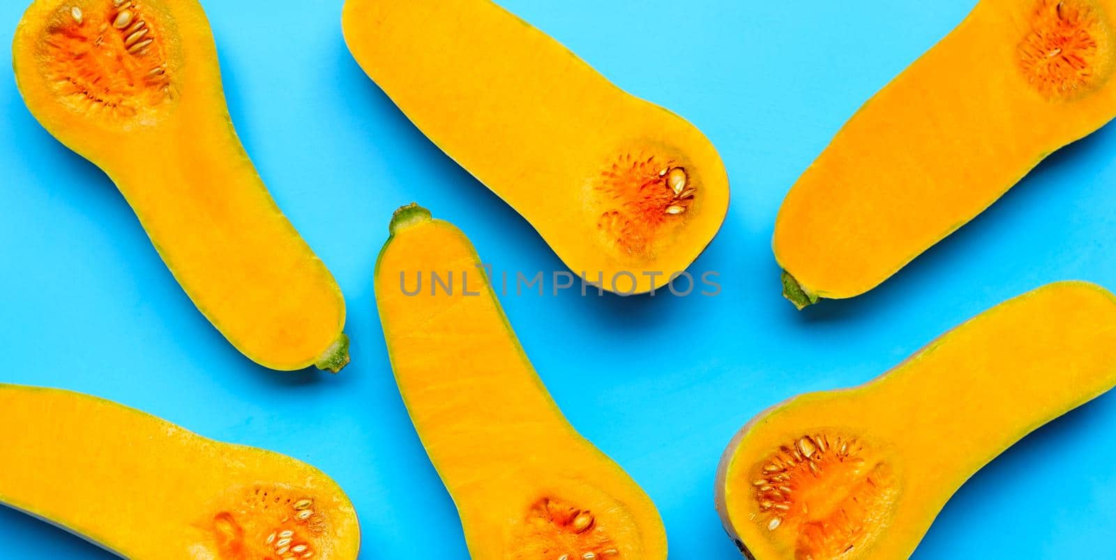 Butternut squash on blue background.