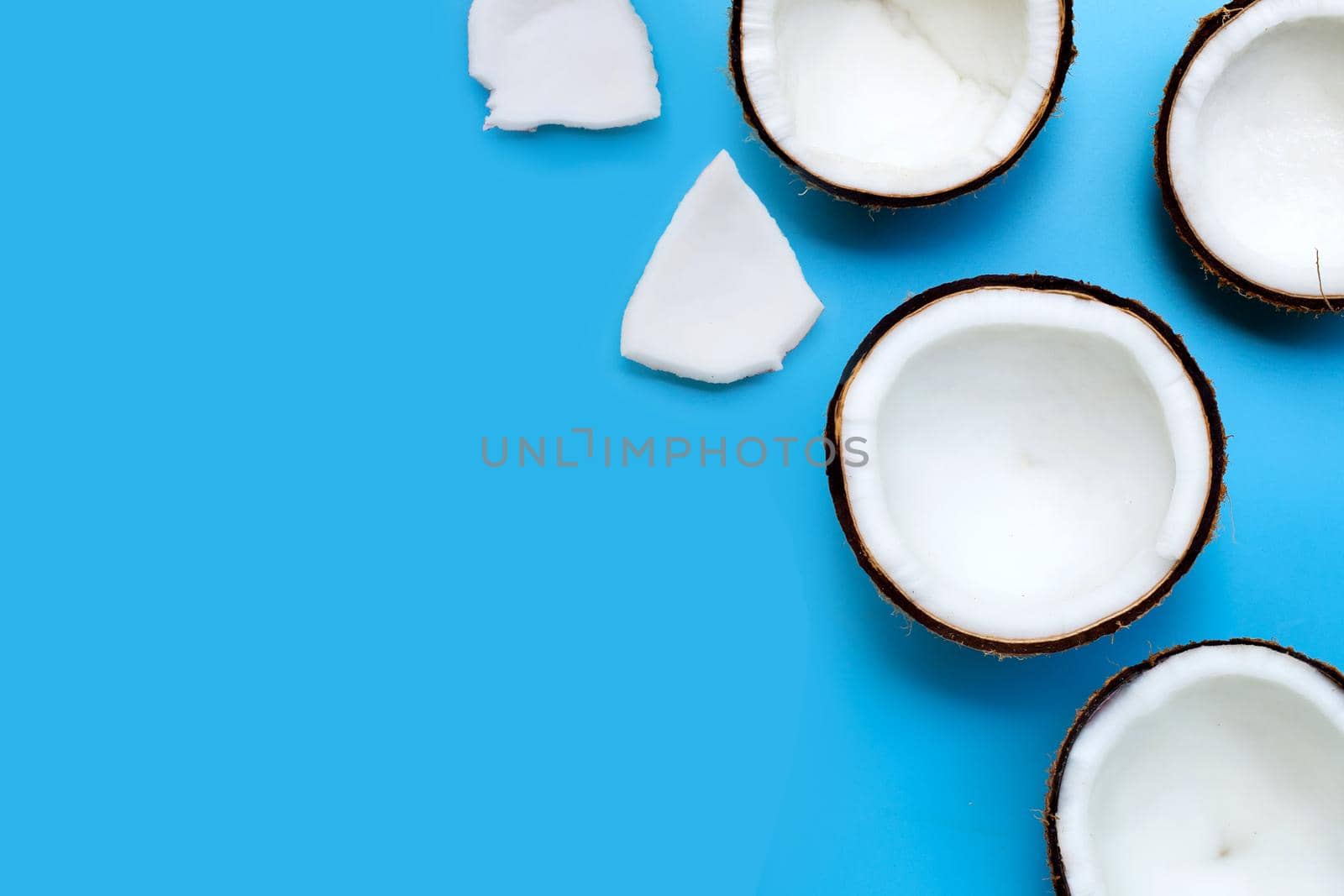 Coconuts on blue background. Top View