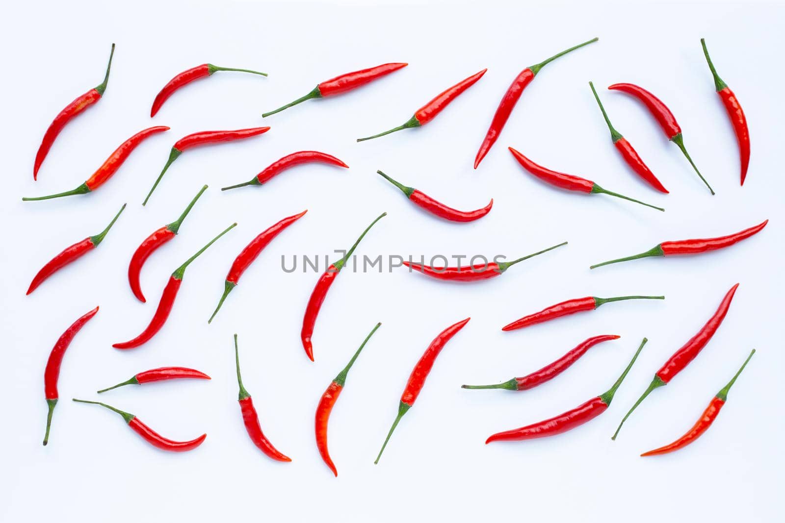 Hot chili peppers on white background. Top view