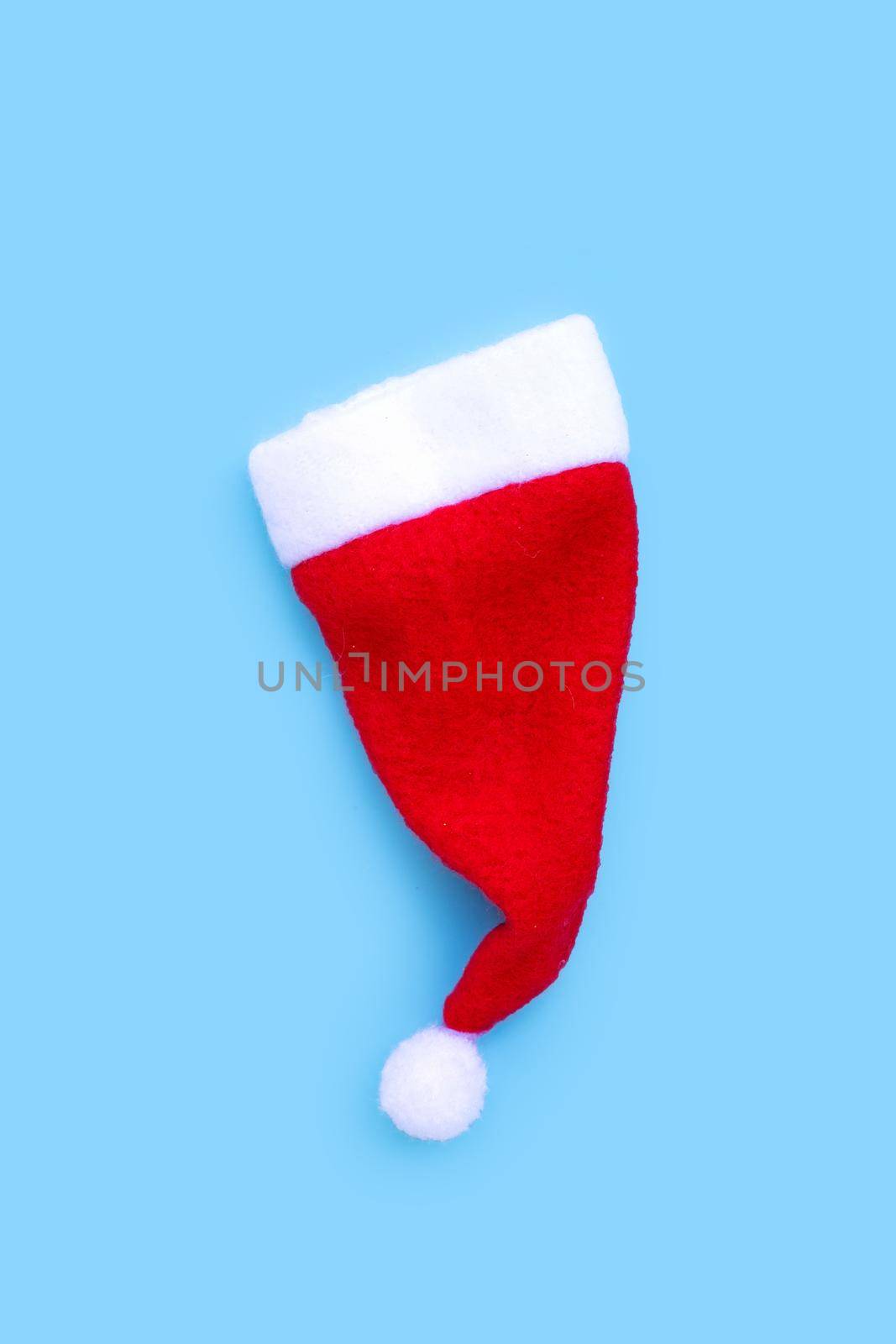 Santa hat on blue background. 