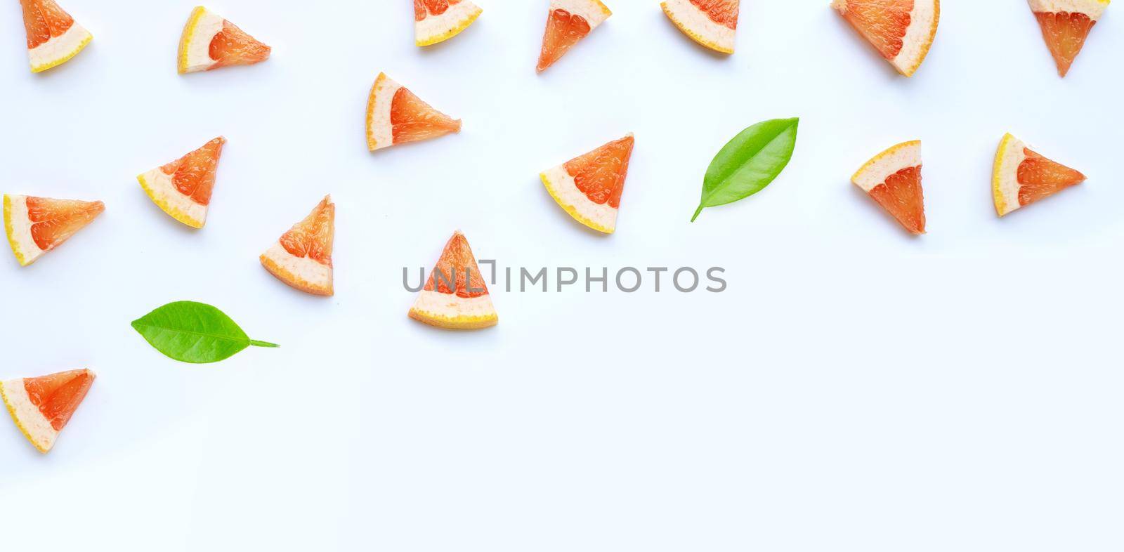 High vitamin C. Juicy grapefruit slices on white background.