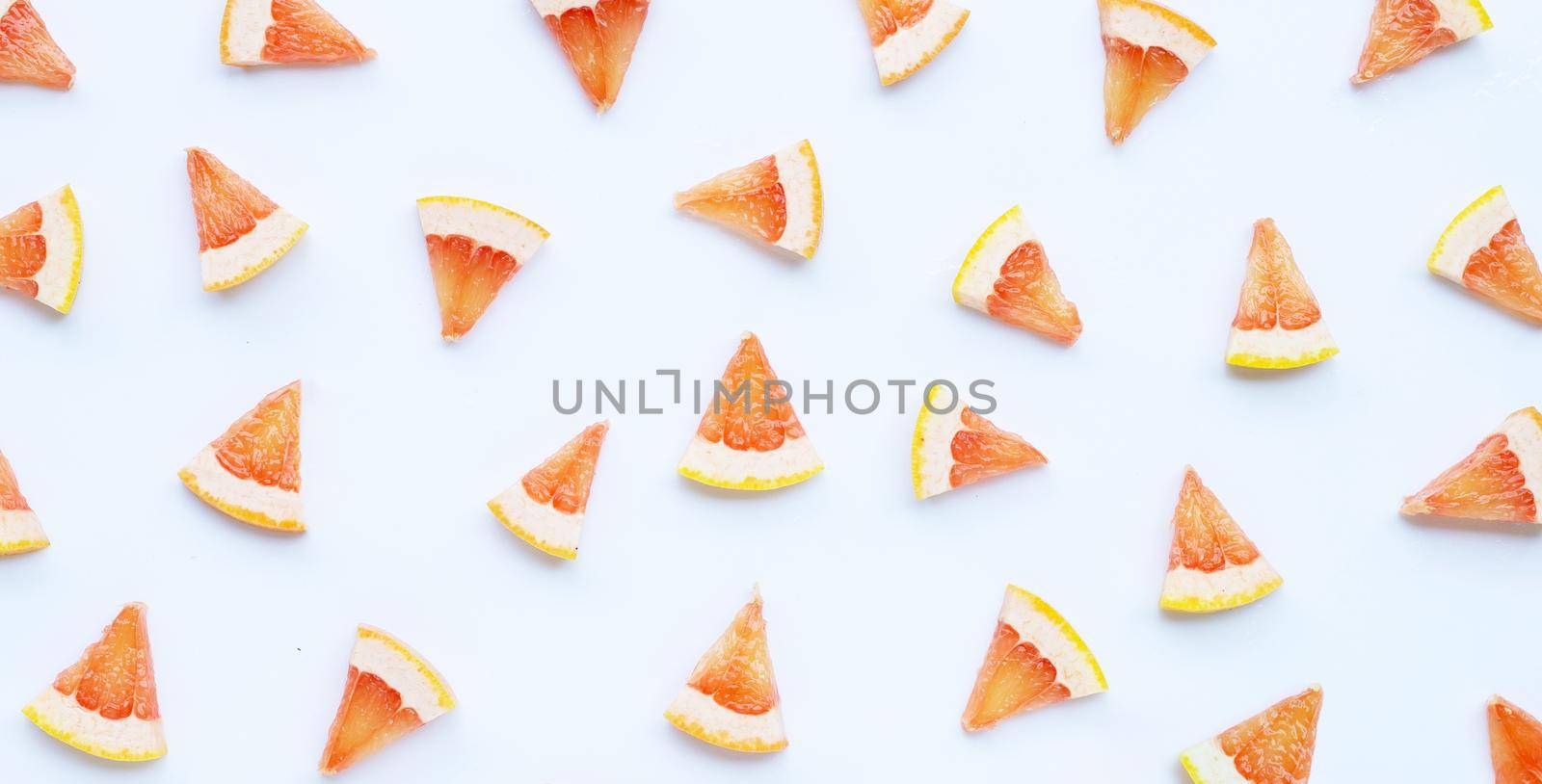High vitamin C. Juicy grapefruit slices on white background.