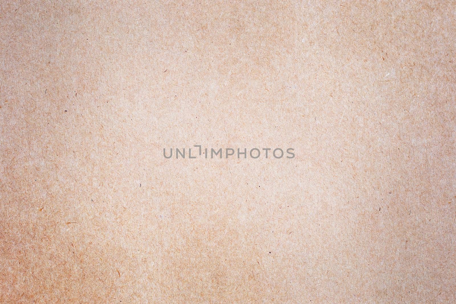 Sheet of brown paper or cardboard texture for background.