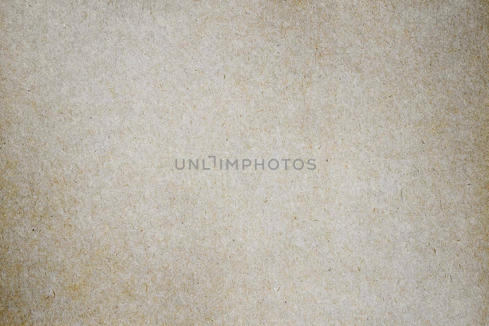 Sheet of brown paper or cardboard texture for background.