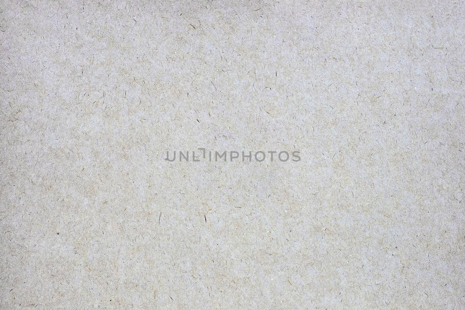 Sheet of brown paper or cardboard texture for background.