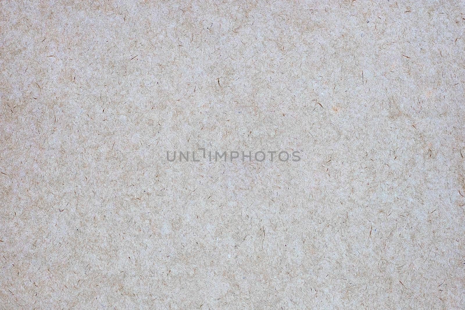 Sheet of brown paper or cardboard texture for background.