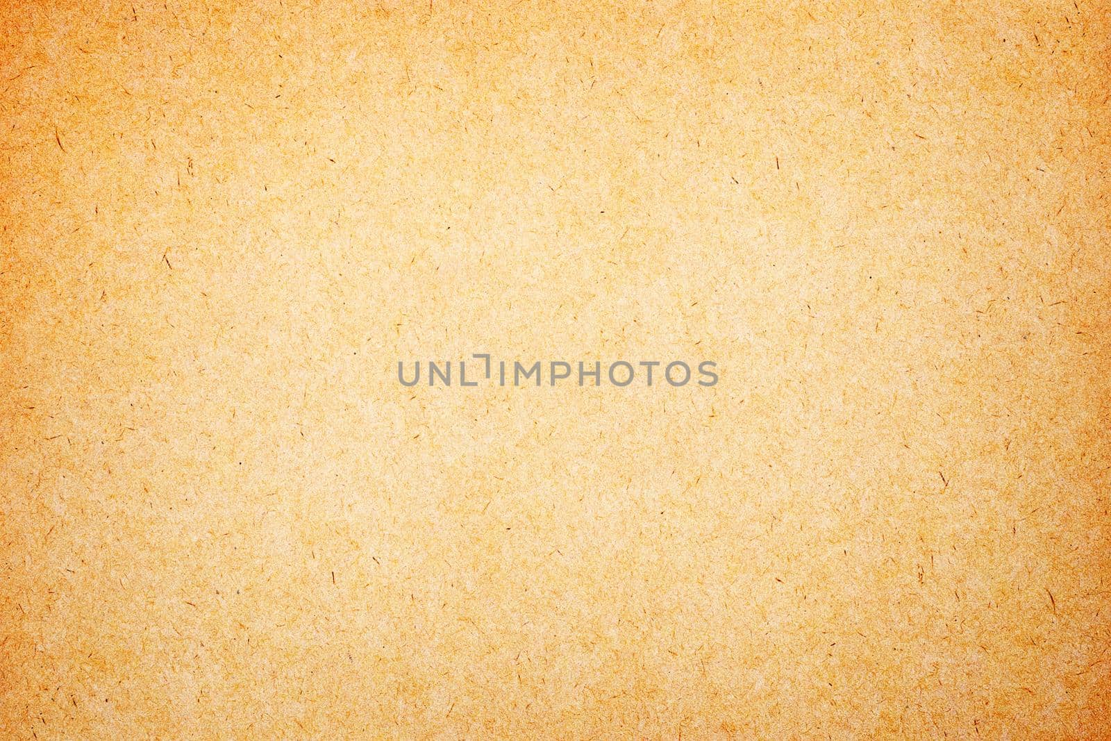 Sheet of brown paper or cardboard texture for background.