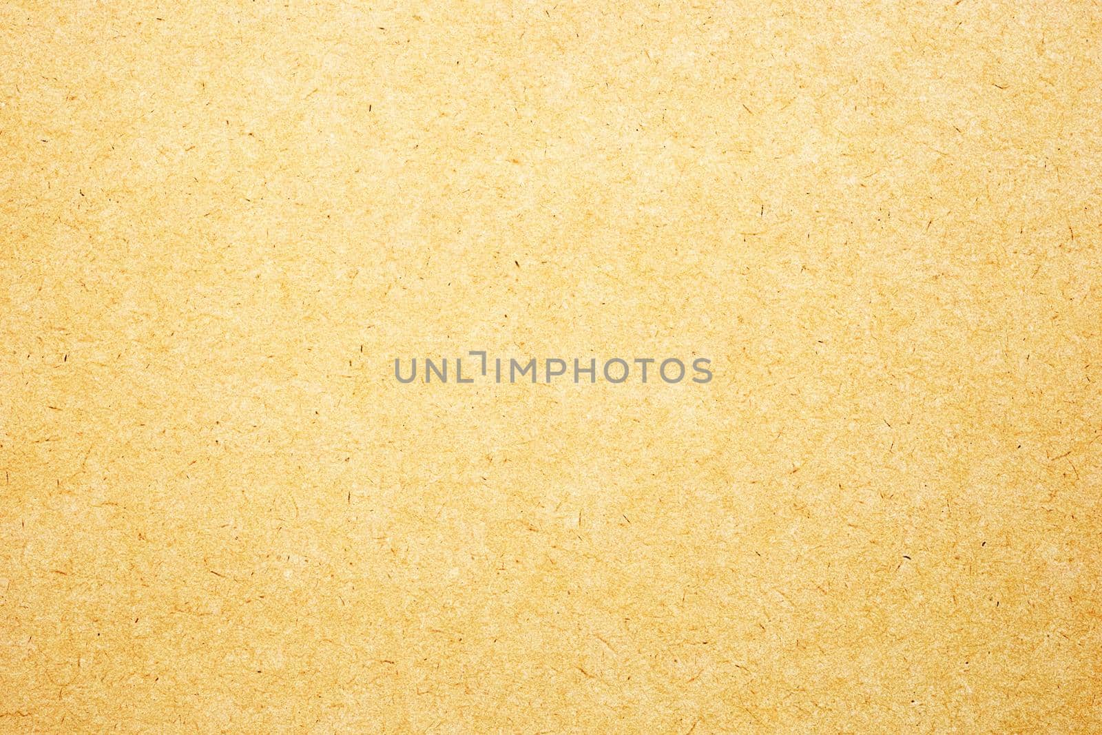 Sheet of brown paper or cardboard texture for background.