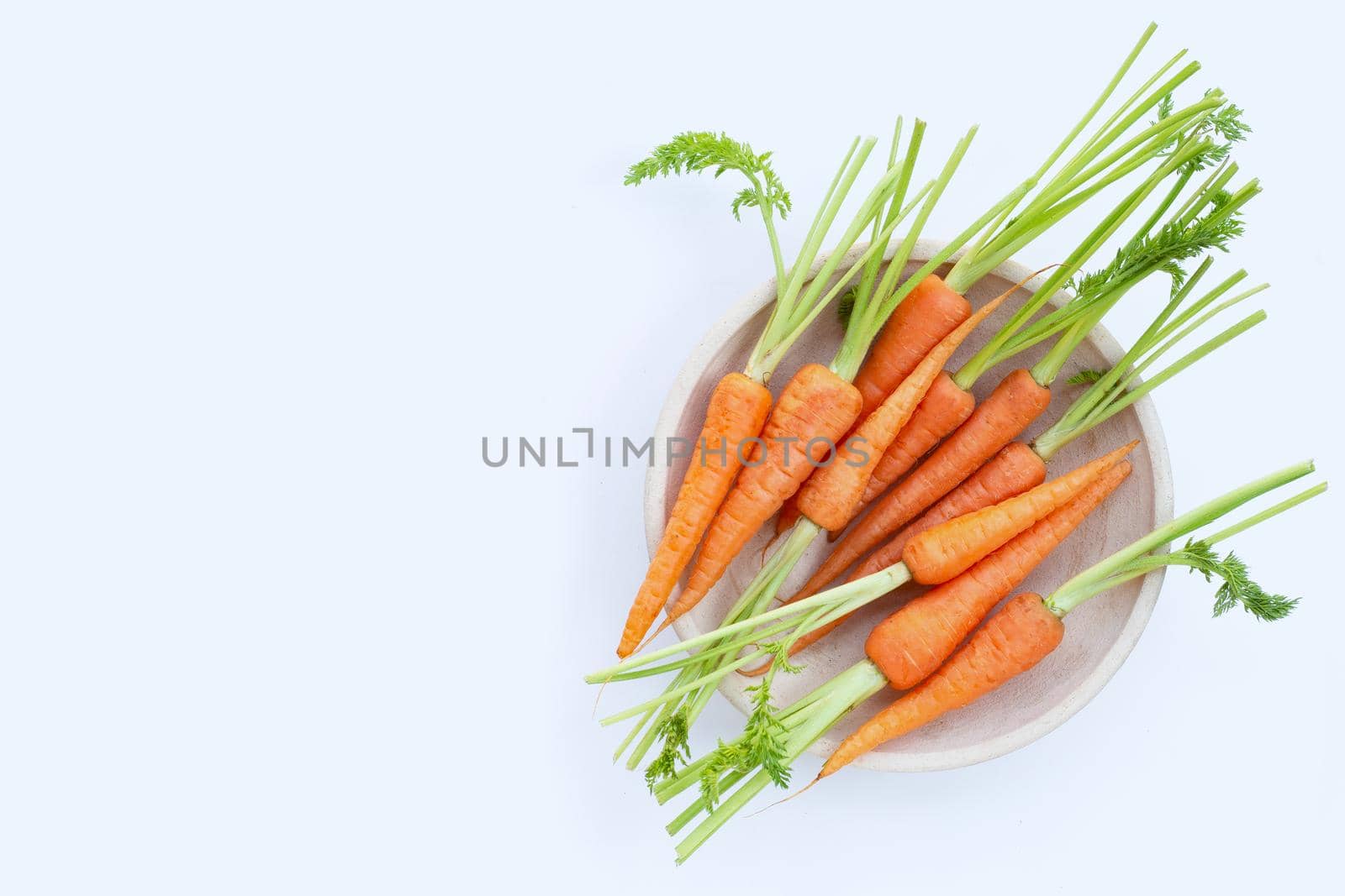 Fresh carrots on white background.